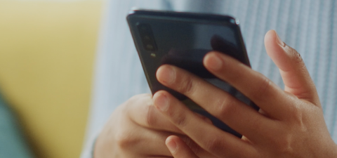 A smartphone held in someone's hands