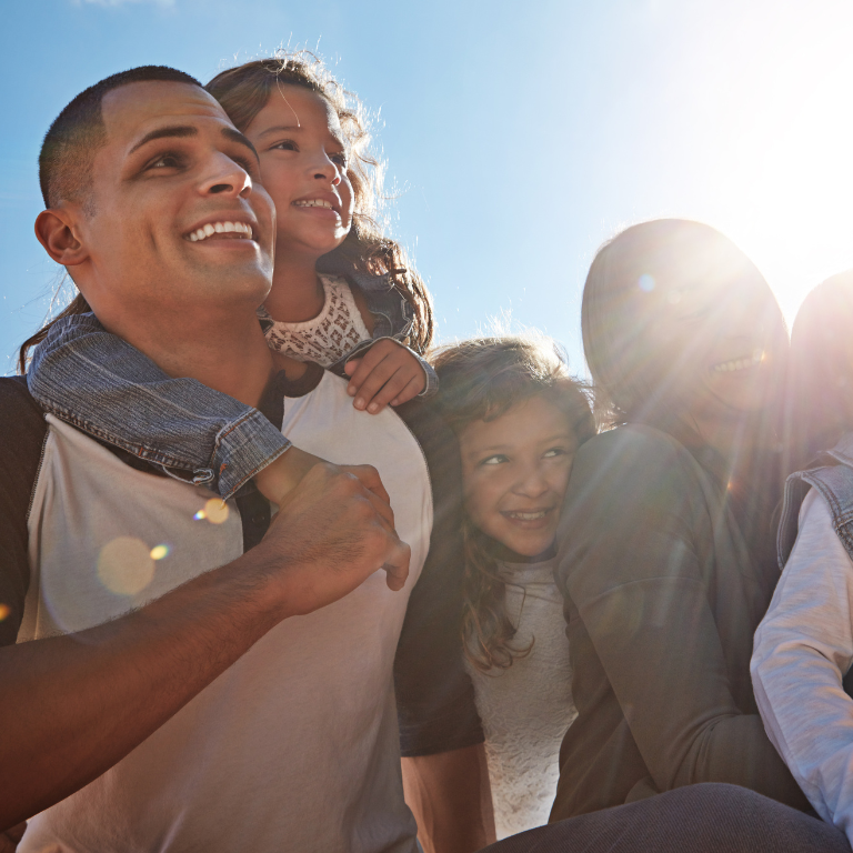 Family of five smiling