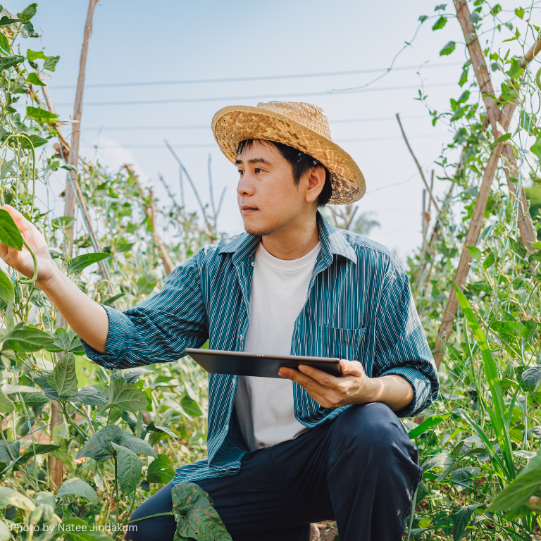 Smart farm with farmer in vegetables garden for support Environmental Social and corporate Governance or ESG policy