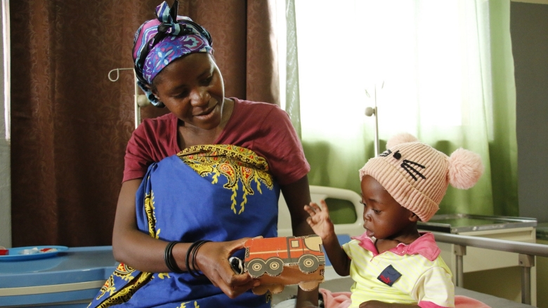 Woman plays with her child in Angola 