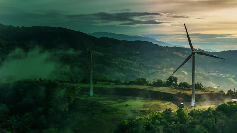 Green mountains landscape with a wind turbine