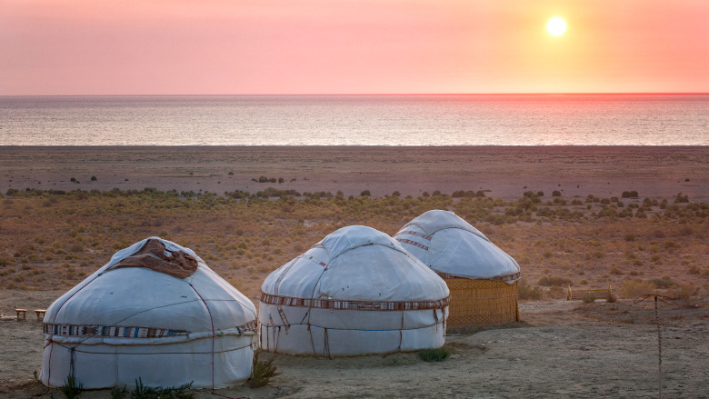 Three yurts at the shore of the Aral Sea