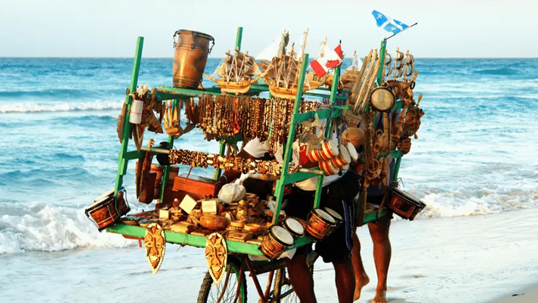 Vendors peddling business in a beach near Dakar, Senegal