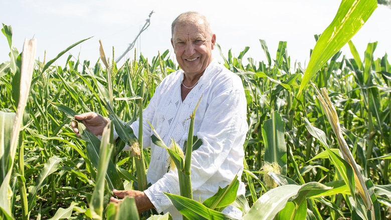 Mykhailo Kolisnyk, a farmer in Ukraine's Poltava region, proudly shows off his corn