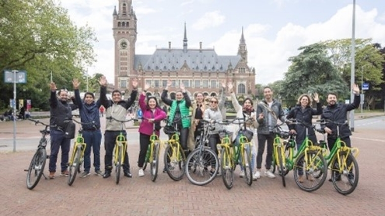 A photo of a group of cyclists.